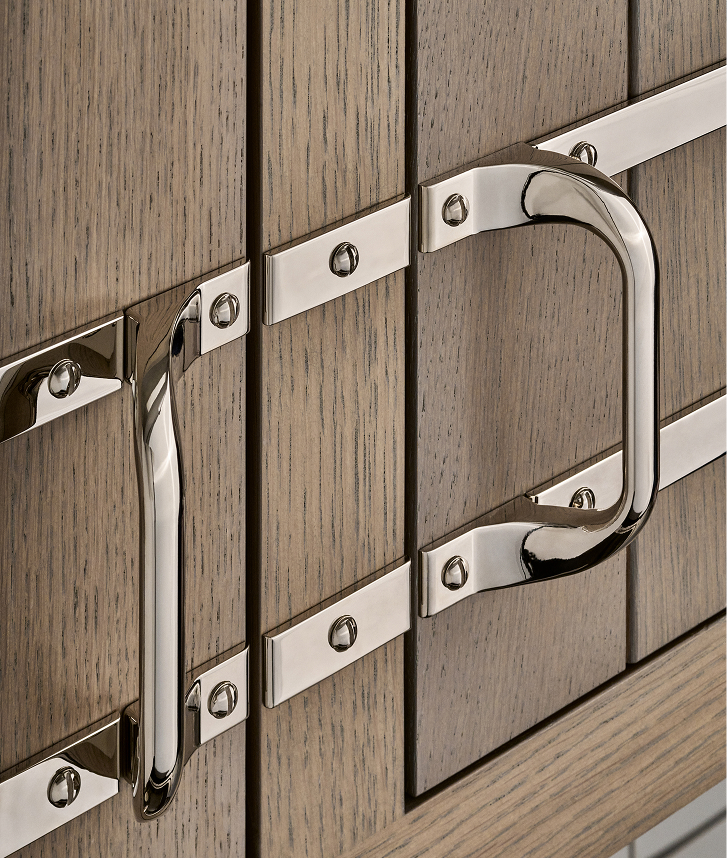 Double brass strapping echoes French neoclassical and vintage influences.