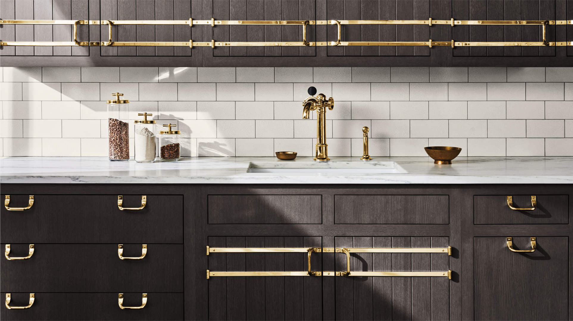 BRIDLE CABINETRY IN DARK. GRAY OAK WITH UNLACQUERED BRASS HARDWARE, ON TAP FAUCET IN UNLACQUERED BRASS AND CLAYBURN FIRECLAY SINK