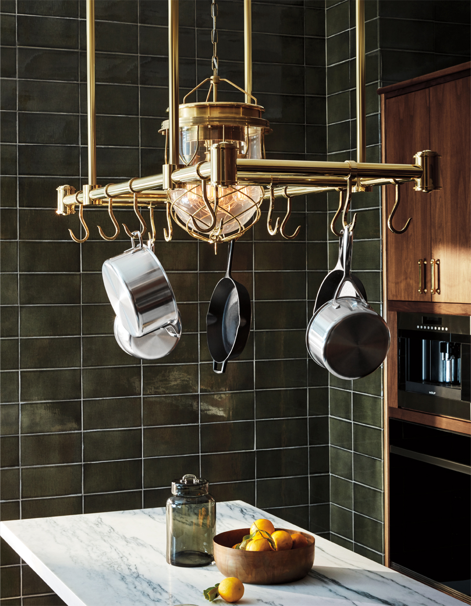 METROPOLE POT RACK IN UNACQUERED BRASS, COMPASS PENDANT IN UNACQUERED BRASS AND ARCHITECTONICS BACKSPLASH IN SHAGREEN